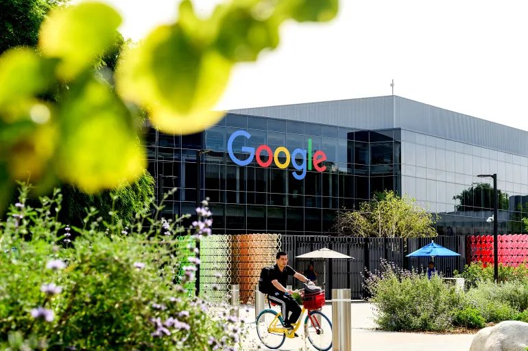 A biker leaves Google headquarters on Thursday, March 26, 2026, in Mountain View, Calif. (AP Photo/Noah Berger)
