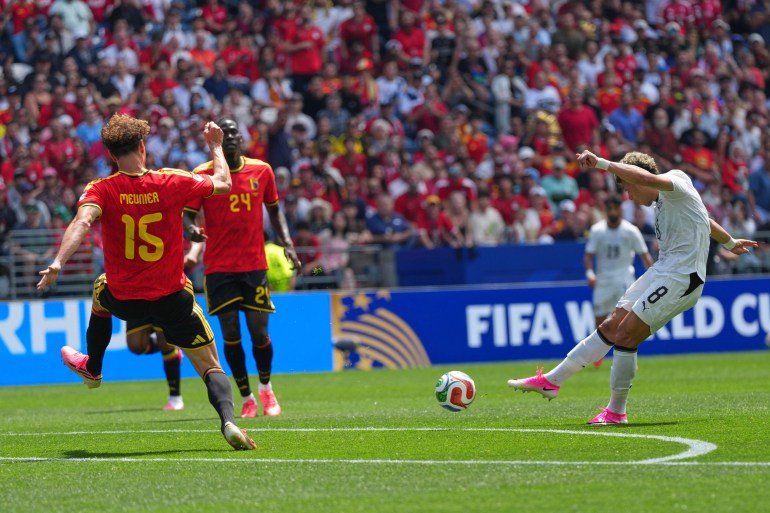Egypt's Emam Ashour, right, shoot and scores the opening goal of the game during the World Cup Group G soccer match between Belgium and Egypt in Seattle, Monday, June 15, 2026. (AP Photo/Manu Fernandez)